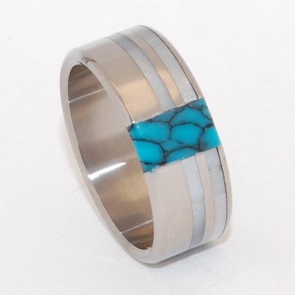 Innocent. Twin bands of glowing gray marbled opalescent are offset by turquoise, stunning against a titanium backdrop. A design well-suited for wider bands. Pictured at 9.5mm. 