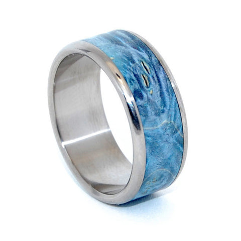 This beautifully crafted, titanium wedding ring has a center inlay of Blue Box Elder. Nicely polished with a mirror finish and fully rounded edges. Pictured at 10.5mm.
