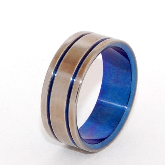 Buy the very ring in the picture!   Size 9.5 at 7.9mm  Head of the class. Handcrafted from a single billet of pure titanium, this band is bookended by two bold pinstripes and a matching anodized blue interior. Mirror finish.  HALF PRICE! Regularly $150.